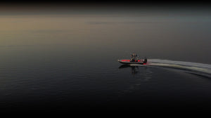 Boat running at dusk with underwater lighting